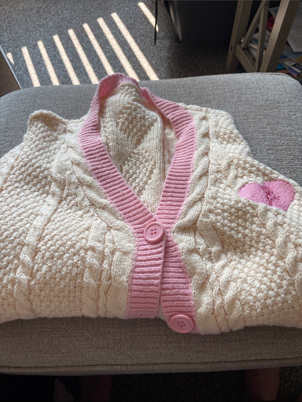 Cream Cable-Knit Cardigan with Pink Trim and Heart Detail